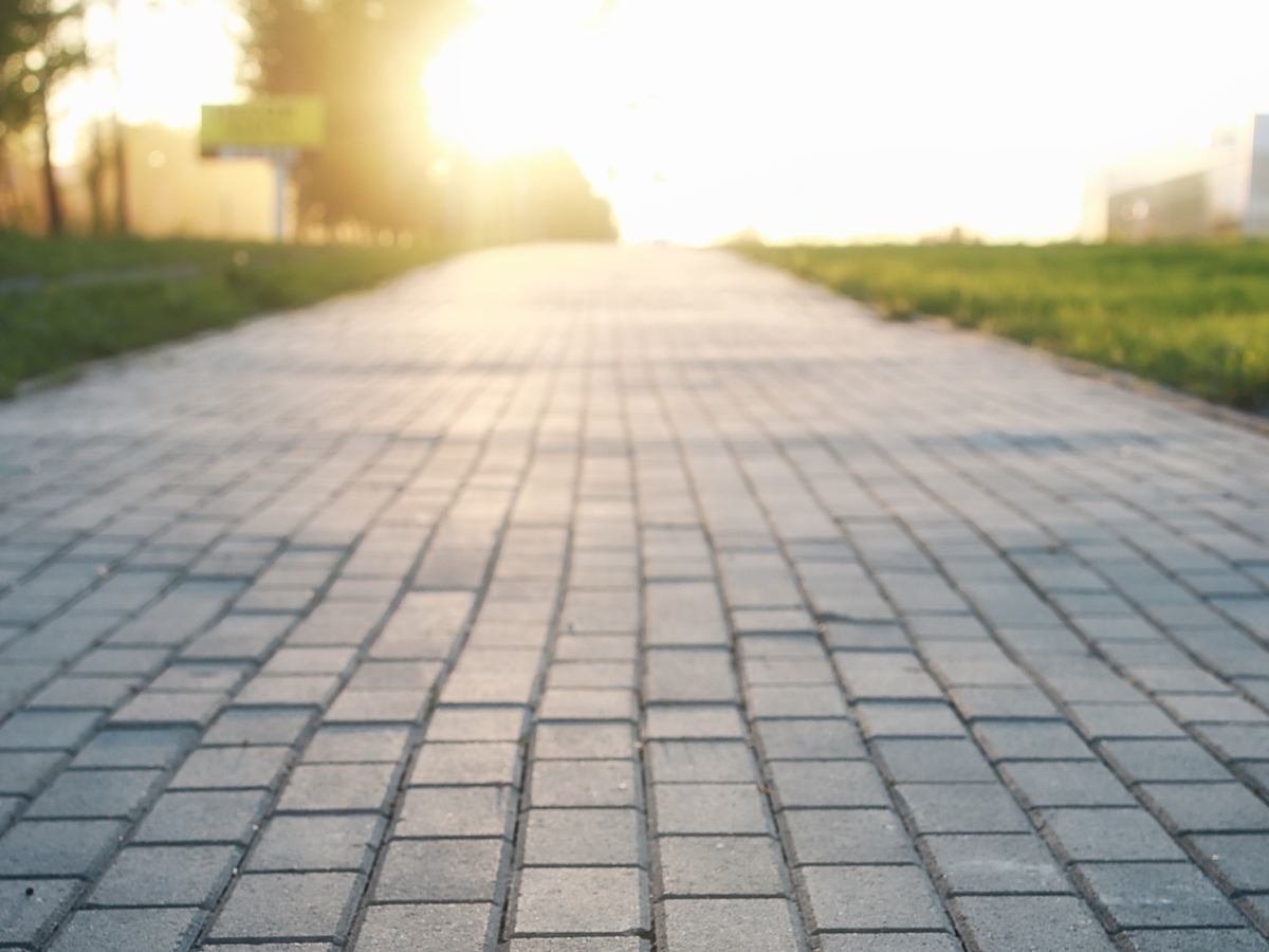a brick road leading into the sun signifying the road to support for suicide prevention